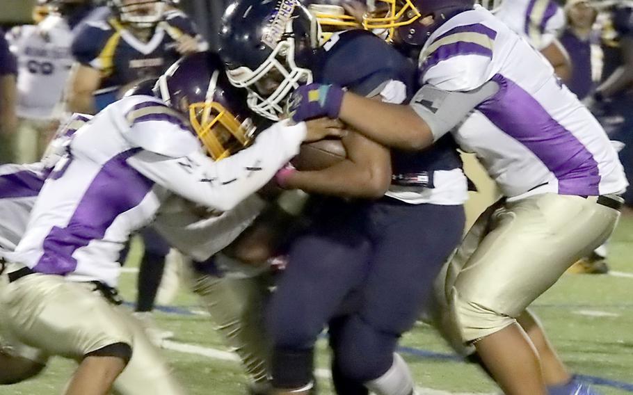 Guam High's RaSean Jacobs finds himself corraled by three George Washington defenders.