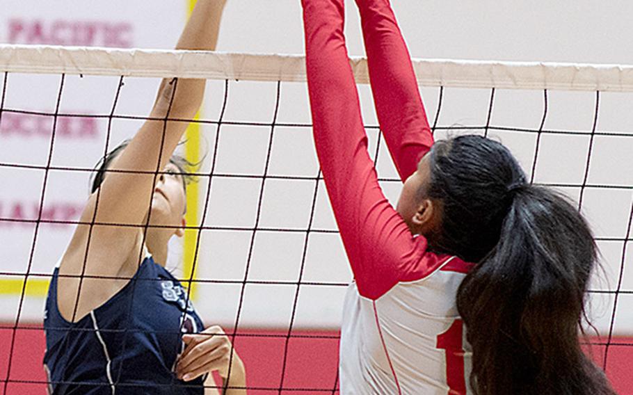 Seisen's Lilu Vandercamme and Nile C. Kinnick's Tori Osterbrink battle at the net during Friday's rematch of the 2017 Far East Division I tournament final. The Phoenix won this one also, 25-18, 25-23, 25-18 over the Red Devils.