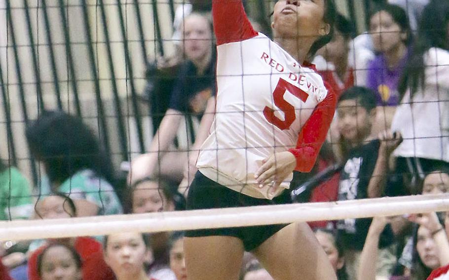 Nile C. Kinnick's Lynelle Adepoju rips a shot against Seisen during Friday's rematch of last year's Far East Division I tournament final. The Phoenix won this one also, 25-18, 25-23, 25-18.