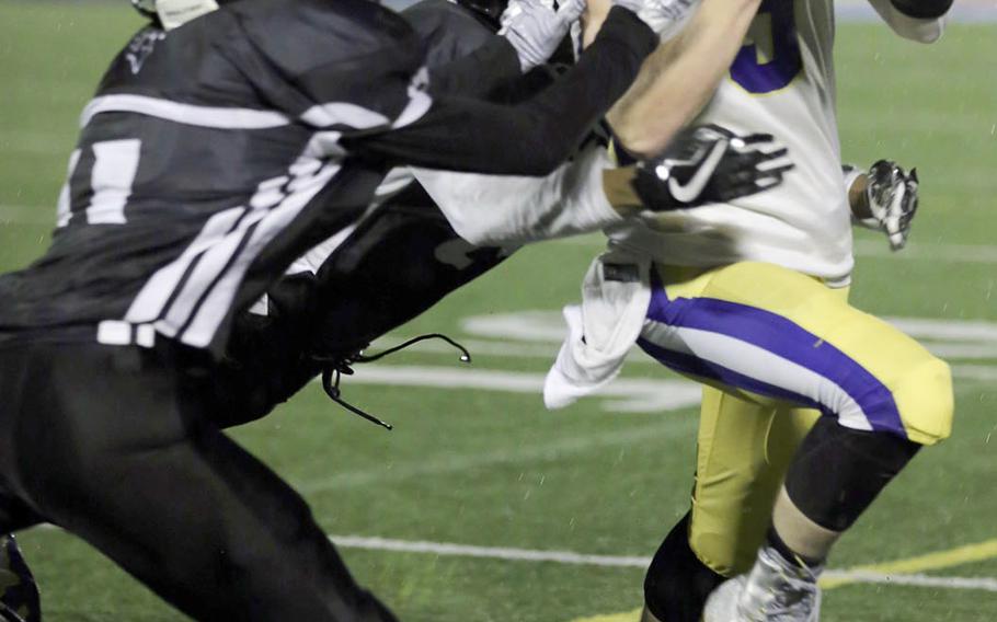 Ethan Gaume scores Yokota's final touchdown in the third quarter as Zama's Justyn Seraphin tries to stop him.