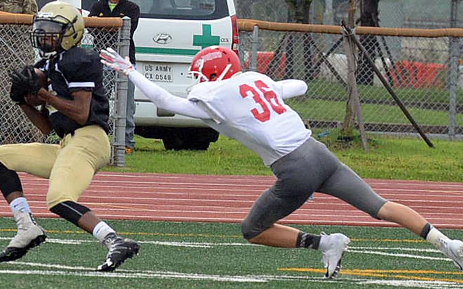 Humphreys' Tevijon Williams snags a pass in front of Nile C. Kinnick cornerback Zach Kornegay.