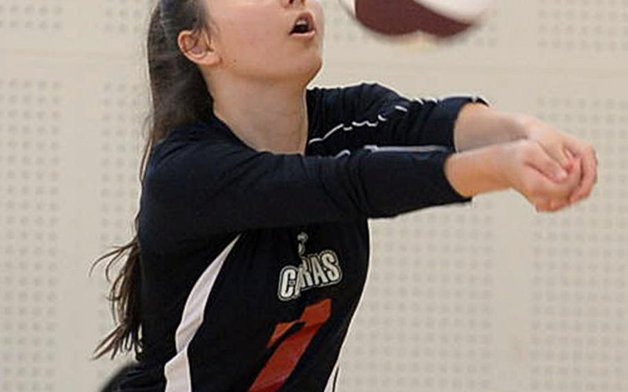 E.J. King's Miya O'Mara digs up a spike against Marist Brothers during Saturday's volleyball match. The Bulldogs beat the Cobras in five sets.
