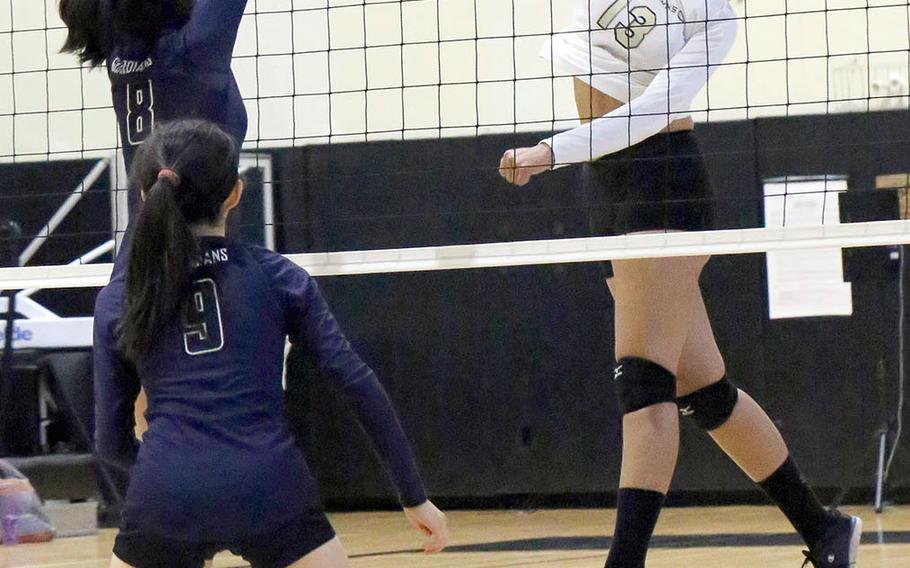 Humphreys' Ebony Dykes tries to hit the ball past Yongsan's Navya Kala and Ashley Cho during Friday's three-set win by the Guardians over the Blackhawks.