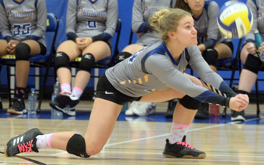 Yokota's Rorie Jenkins digs up a serve from Sacred Heart during Monday's five-set win by the Panthers over the Symbas.