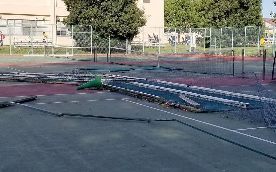 Yokota High School's tennis court fencing and court border separation wood took a pounding Sunday from Typhoon Trami and the courts are no longer playable, according to coach Tommy Palmer and athletics director Tim Pujol.