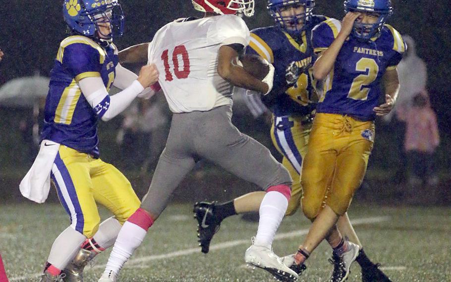 Nile C. Kinnick receiver Chris Watson gets corraled by Yokota's defense.