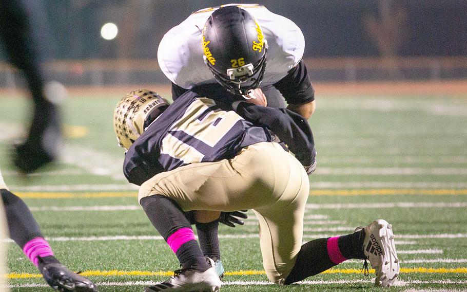 Humphreys defenseive back Isaiah Alexander stuff Kadena running back Alfonso Mendez near the goalline durring a football game at Camp Humphreys, South Korea, Saturday, Oct. 13, 2018. 