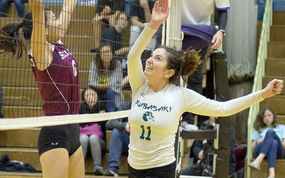 Kubasaki's Donatella Barone and Seisenl's Sarah Atanacio nearly collide at the net over the ball during Saturday's Dragons' three-set win over the Phoenix for the YUJO IV tournament title.