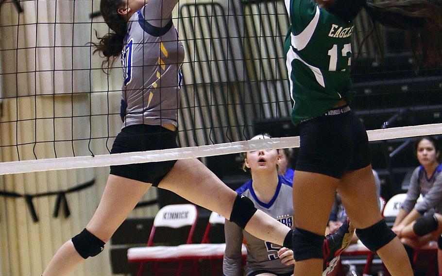 Yokota's Adrianna Diaz and Robert D. Edgren's Lily Enanoria battle at the net for the ball during Thursday's match in the DODEA Japan girls volleyball tournament. Yokota won in straight sets.