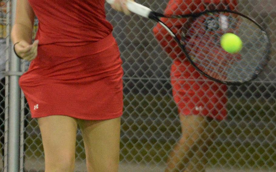 Nile C. Kinnick's Jillian Mock hits a forehand return against Matthew C. Perry's Marion Vesprey during Friday's girls singles A play in the DODEA-Japan tennis tournament.