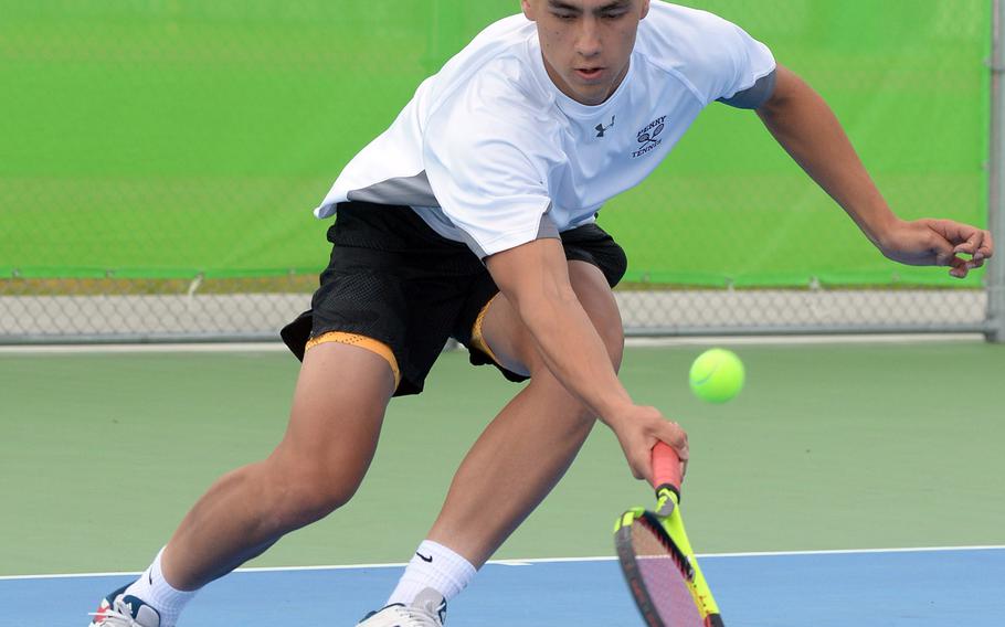 Matthew C. Perry's Kai Lange plays a ground stroke during his 8-0 loss Friday to Nile C. Kinnick's Daniel Posthumus in the DODEA-Japan tennis tournament.