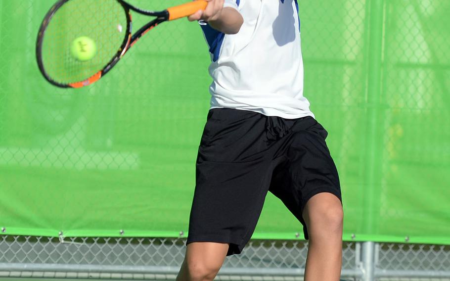 Yokota freshman Kai Deremer smacks a forehand return against E.J. King's Takumi Kodama during Saturday's boys singles A final in the DODEA-Japan tennis tournament. Deremer won 9-7.