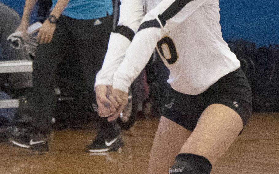 Kadena defender Crystalyn Hicom bumps against Urasoe Kogyo during Saturday's action in the Okinawa-American Volleyball Festa at Kadena Air Base's Risner Fitness Center. The Panthers won 25-8, 25-11.