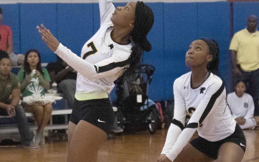 Kadena's DeJaila Simms goes up to hit as Ayanna Richard covers for her against Urasoe Kogyo during Saturday's action in the Okinawa-American Volleyball Festa at Kadena Air Base's Risner Fitness Center. The Panthers won 25-8, 25-11.