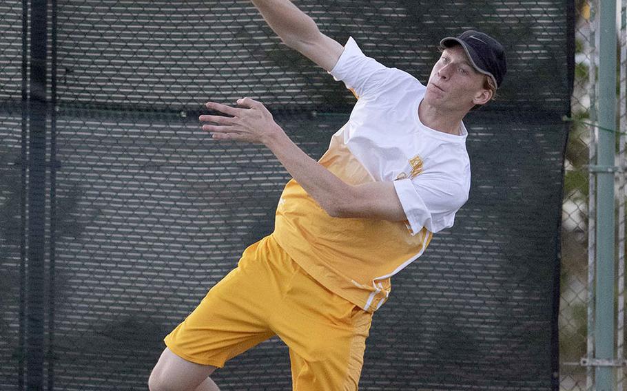 Kadena's Brett Davis hits an overhand return during Tuesday's singles and doubles matches with Kubasaki. Davis won his singles tie 6-2 over Henry Ruksc and teamed with Royce Smola to beat Ruksc and Max Weidley 6-4.