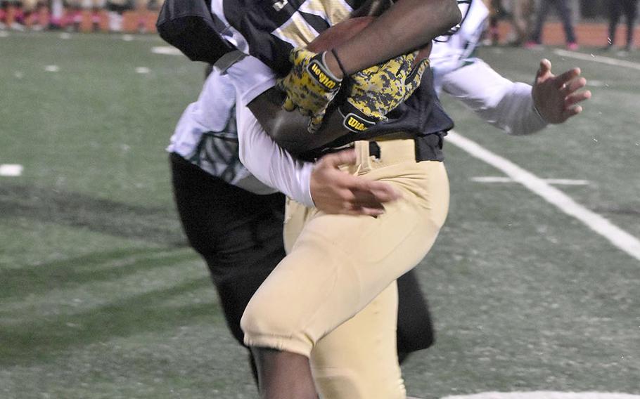 Humphreys' Josiah May tries to shed the tackle of Daegu's Kekai Chun-Andrade.