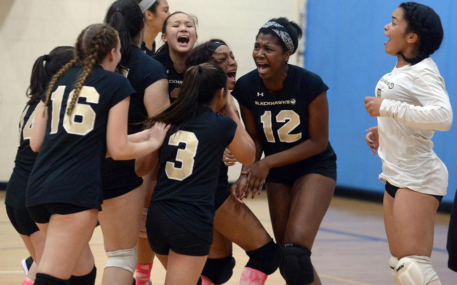 A happy group of Humphreys Blackhawks celebrates ia school-first Korea Plate Tournament volleyball title.