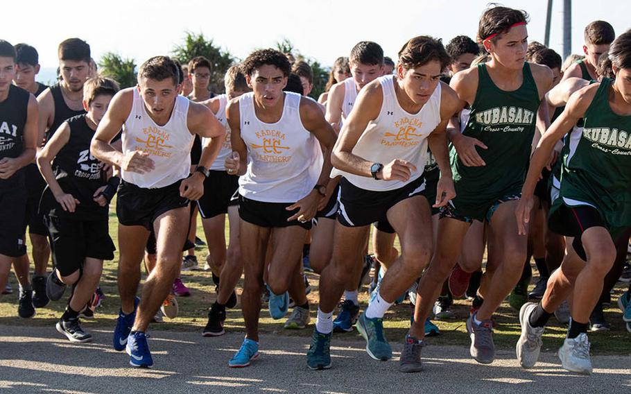 Kadena's Hayden Bills, Trevor Williams and Guy Renquist lead the pack off the starting line in Friday's Okinawa cross country finals.