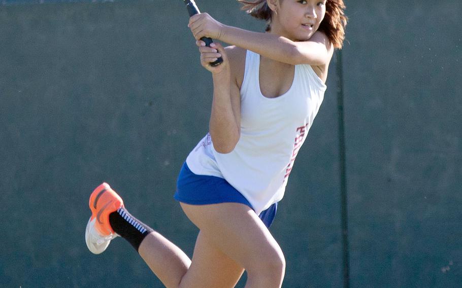 Seisen's Sarah Omachi belts a backhand en route to a two-set singles finals win Tuesday over ASIJ's Eriya Hara.