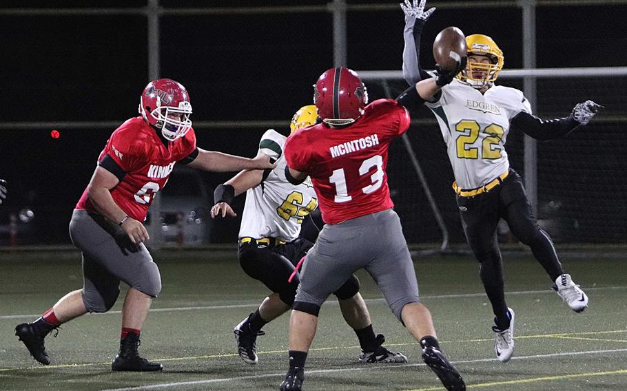 Kinnick quarterback John McIntosh lets fly over Edgren defender Douglas Tackney.