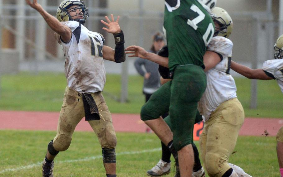 Humphreys quarterback Miles Brice launches a pass over the outstretched hand of Kubasaki defender Lucas Kappen.