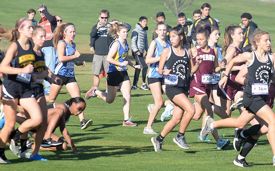 Matthew C. Perry's Angelique Armijo, right, leads the pack from the start of Monday's Far East girls race as one runner stumbles in the middle of the course.