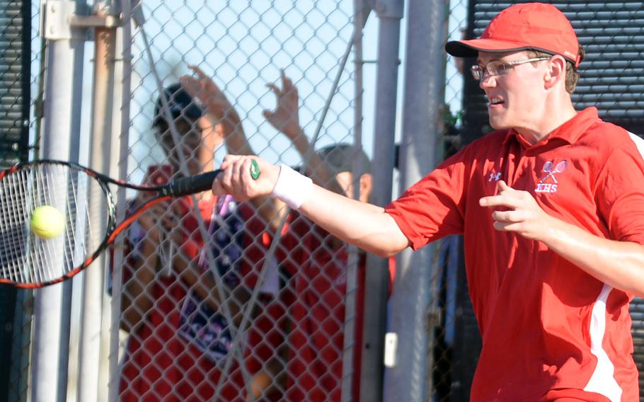 Kinnick's Daniel Posthumus rips a forehand return during Thursday's boys singles quarterfinal loss to Kaito Masuda of Christian Academy Japan.
