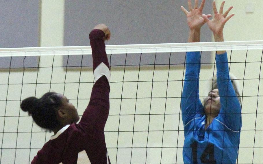 Osan's Maja Inthavixay goes up to block a spike by Perry's Taniya Smith during the Cougars' two-set win over the Samurai on Day 1 of the Far East Division II Tournament.