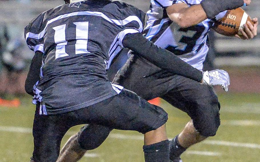 Osan's Joey Betts tries to run around Zama's Justyn Seraphin.