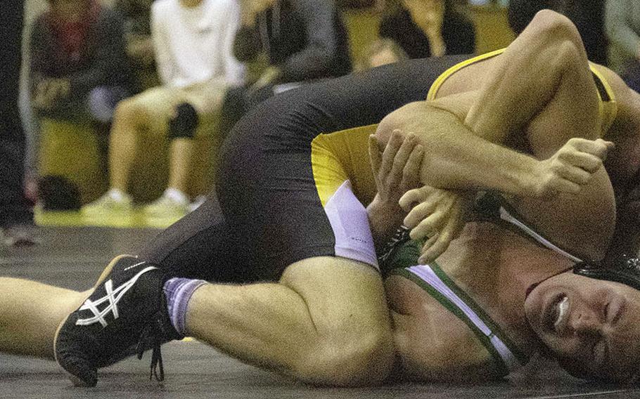 Kadena's Fisher Brown gains the edge over Kubasaki's Dylan Galbraith in the 180-pound bout during Wednesday's Okinawa wrestling dual meet. Brown pinned Galbraith in 2 minutes, 45 seconds, but the Dragons won the meet 35-26.