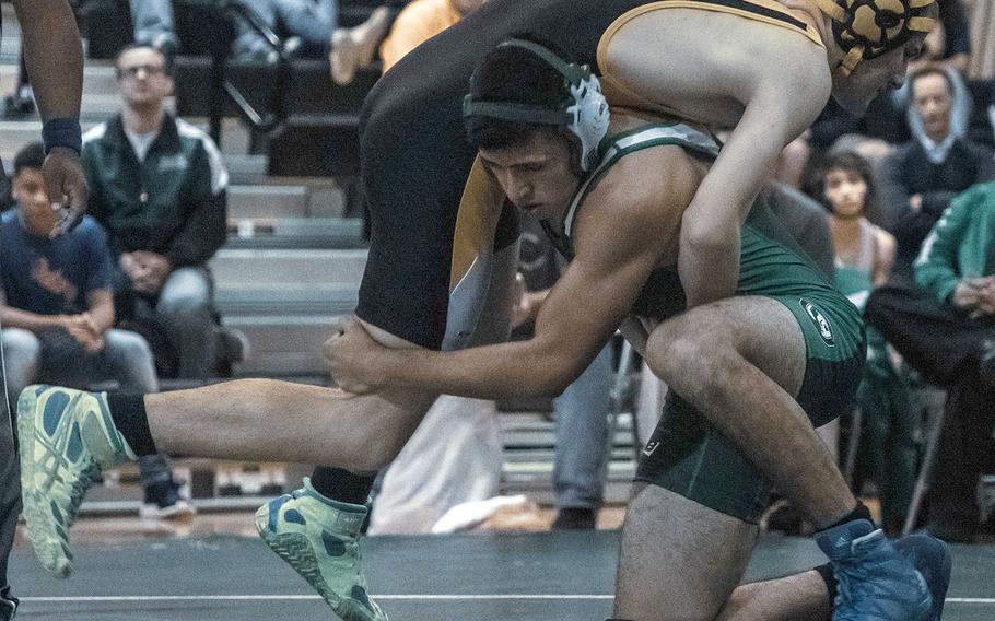 Kubasaki's Mateo Barrientos tries to lift Kadena's Nick Neary in the 158-pound bout during Wednesday's Okinawa wrestling dual meet. Neary rallied to pin Barrientos in 1 minute, 8 seconds, but the Dragons won the meet 42-18.