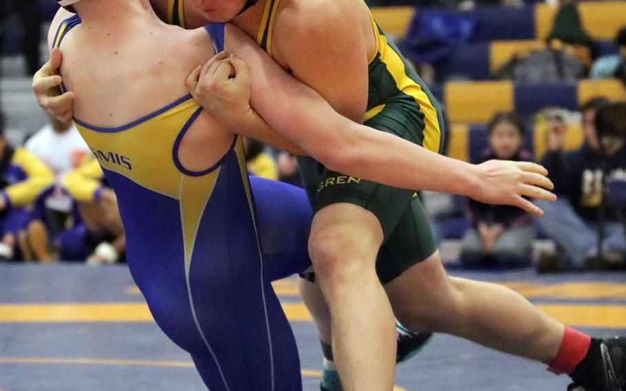 Robert D. Edgren's Chase Quigley takes St. Mary's Michael Patton to the mat in the 215-pound final bout of Saturday's Yokota Invitational Wrestling Tournament. Quigley pinned Patton in 2 minutes, 3 seconds.