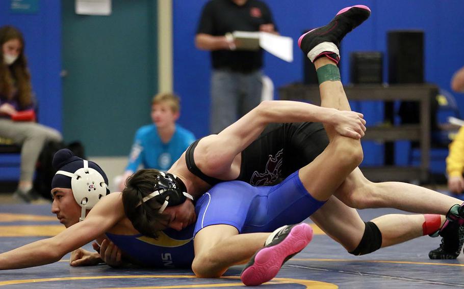 Matthew C. Perry's Brad Ponsiano gains the upper hand on St. Mary's Jasjot Bedi in the 122-pound final of Saturday's Yokota Invitational Basketball Tournament. Bedi rallied to pin Ponsiano in 2 minutes, 4 seconds.