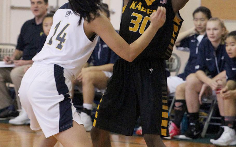 Kadena's Atiria Simms looks to pass against Taipei American during Saturday's Taipei Basketball Exchange girls game. The Tigers downed the Panthers 56-44.