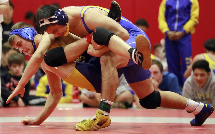 St. Mary's Austin Koslow gains control of Yokota's Austin Fisher in the 180-pound final of Saturday's Nile C. Kinnick Invitational "Beast of the Far East" wrestling tournament. Koslow pinned Fisher in 59 seconds.