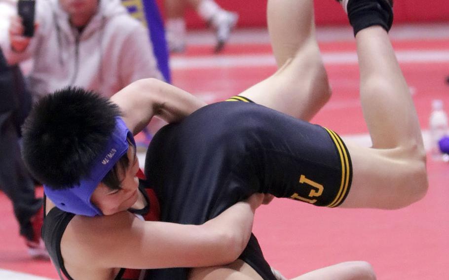 Shonan Military Academy's Ryogo Asano lifts American School In Japan's Take Zoot in the 115-pound final of Saturday's Nile C. Kinnick Invitational "Beast of the Far East" wrestling tournament. Asano pinned Zoot in 2 minutes, 28 seconds.
