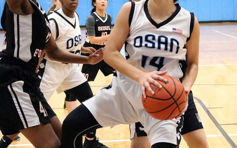 Osan's Maja Inthavixay looks for shooting room against Seoul Foreign during Wednesday's Korea girls basketball game. The Crusaders won 36-33.