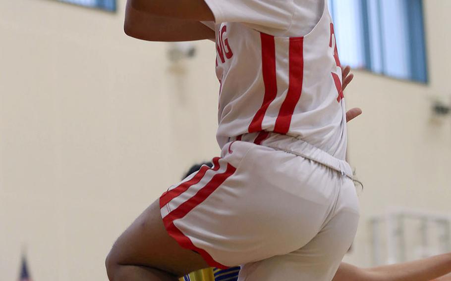 E.J. King's Jalen Nall skies for a shot against Yokota during Friday's Japan boys basketball game. The Cobras won 54-32.