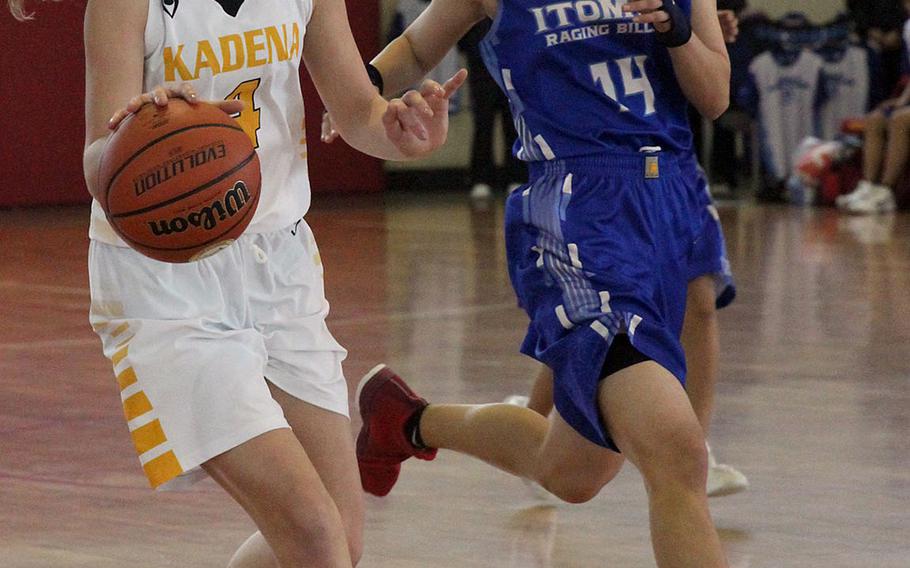 Kadena's Megan Kirby dribbles against an Itoman defender on Day 1 Saturday of the 13th Okinawa-American Friendship Basketball Tournament. The Raging Billows routed the Panthers 72-37.