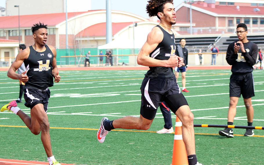 Humphreys' Quintin Metcalf and Jalen Hill complete the first lap en route to a 1-2 finish in the 800 during Saturday's Humphreys Invitational track and field meet.