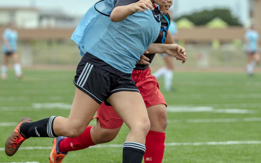 Kadena's Mikayla Benitez drives against Naha Shogyo during Saturday's girls soccer game, won by the Panthers 10-0.