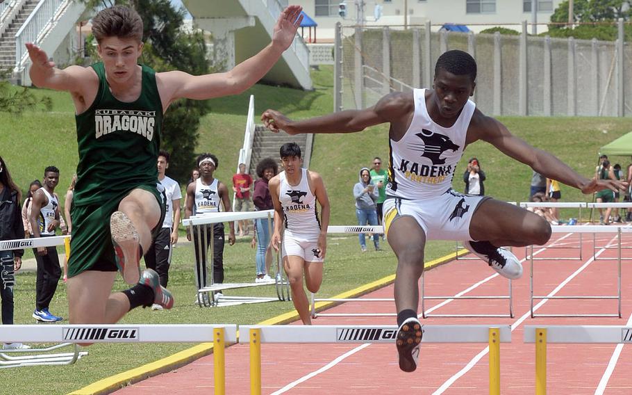 Kadena freshman Kevonte Speight and Kubasaki senior Dylan Galbraith go at it in the 300 hurdles during Saturday's Okinawa track and field meet. Speight edged Galbraith by .02 seconds, 46.91 to 46.93.