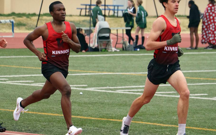 Nile C. Kinnick's Hanokheliyahu Gailson and Carlos Mobley run 1-2 in the home stretch of the 1,600 during Saturday's Japan track and field meet. Gailson took first in both the 1,600 and 3,200, with Mobley finishing third and fourth.