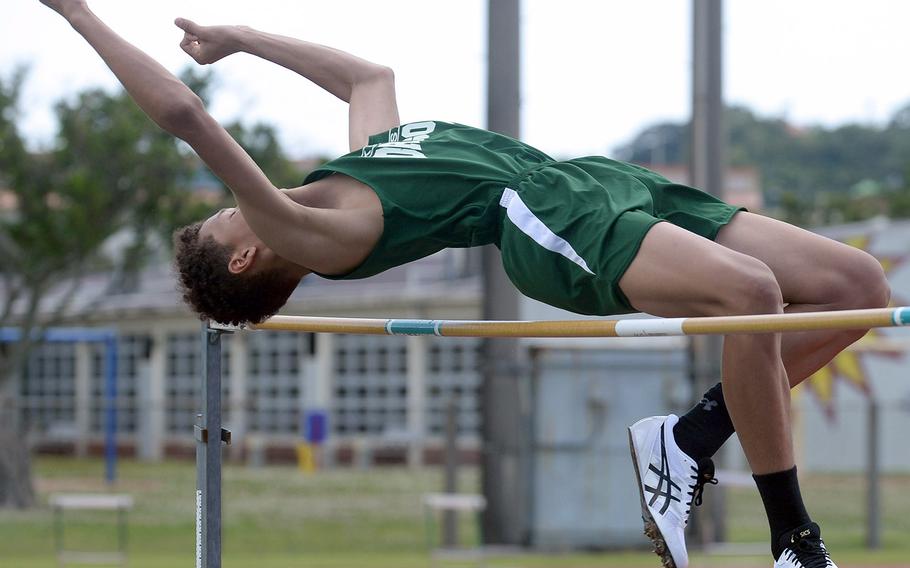 Kubasaki's Tristan Higginson clears the bar in the high jump during Saturday's 15th Mike Petty Memorial Meet at Kubasaki HIgh School. Higginson tied with Kadena's Xavier Peace at 5 feet, 8 inches.