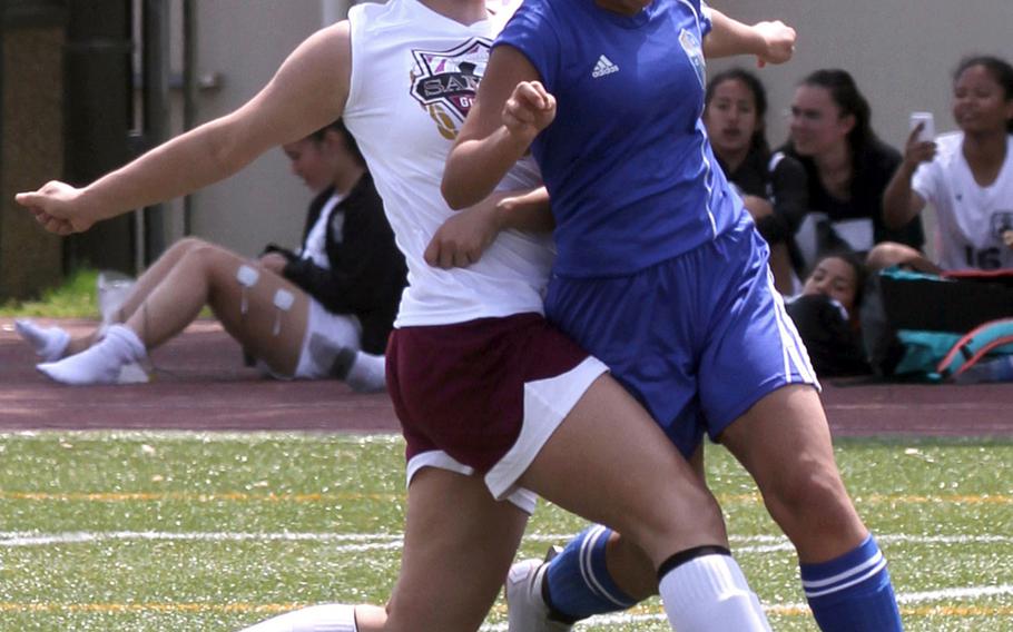 Matthew C. Perry's Hazel Bolduc and Yokota's Noelle Asato tangle for the ball during Friday's DODEA-Japan girls soccer match. The Panthers won 3-1.