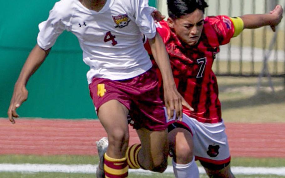 Nile C. Kinnick's Jazel Mendoza and Matthew C. Perry's Shion Fleming battle for the during Saturday's DODEA-Japan boys soccer tournament final. The Samurai won 4-1.