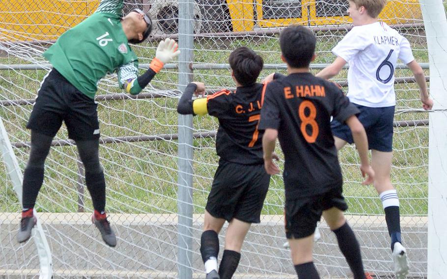 Seoul International goalkeeper Haanbi Kim can't quite get a hand on a shot toward the corner of the net against Osan during Friday's Korea boys soccer Plate Tournament at Osan Air Base. The host Cougars won 3-0.