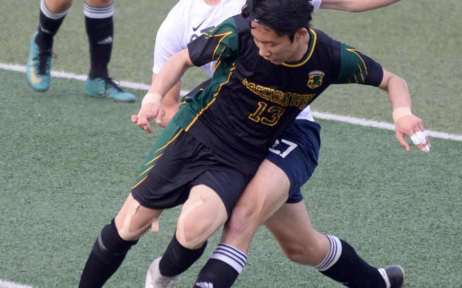 Osan's Jacob Pittner and Asia-Pacific's Francesco Oh collide in a chase for the ball during the final.