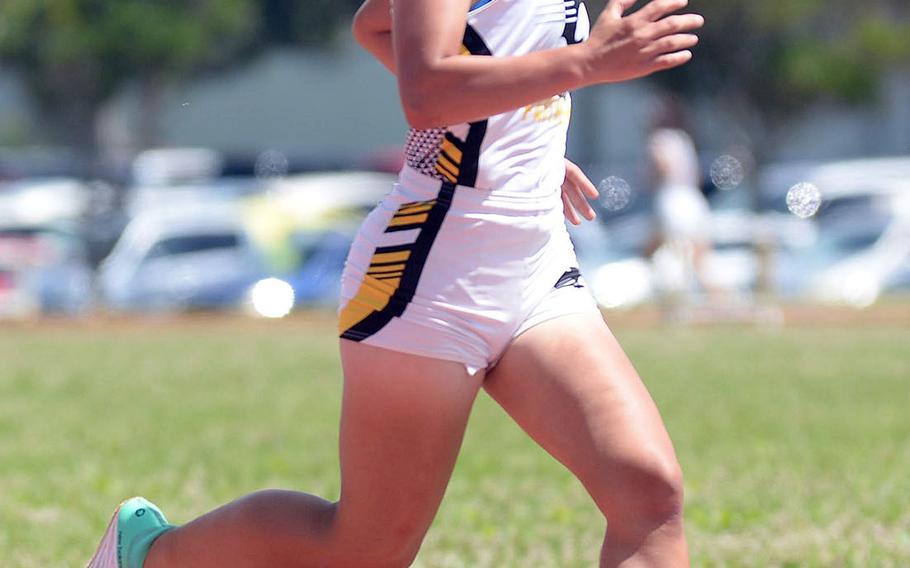 Kadena's Isamar Vargas heads toward victory in the 1,600 during Saturday's Okinawa district finals.