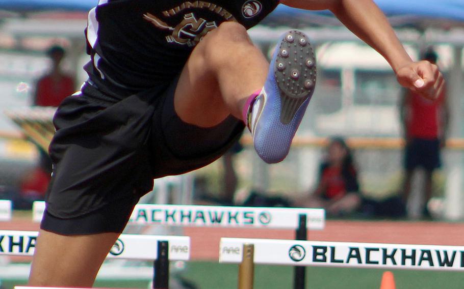 Humphreys' Isaiah Alexander negotiates a hurdle en route to a second-place finish in the 110 hurdles during Friday's Korea Last Chance Invitational.
